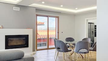 60-inch LED TV with cable channels, fireplace