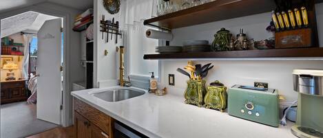 Fridge, microwave, coffee/tea maker, cookware/dishes/utensils