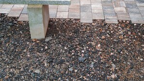 A patio area with a picnic table, a small Christmas tree, and a stone bench. - New single-storey chalet in Gérardmer (Xonrupt-Longemer)
