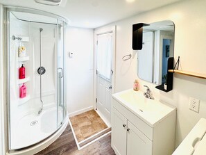 Shower, hair dryer, towels, soap
