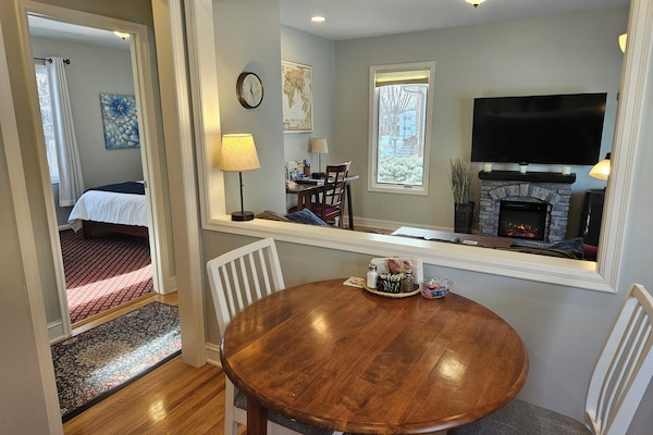 Kitchen table with views of living room and TV