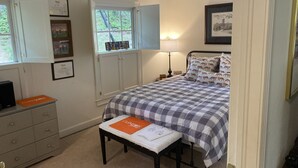 A bedroom with a bed, a desk, a chair, a window, and a door. - Apartment in Downtown Clemson. Just a few minutes to Campus & Football Stadium. (Clemson)