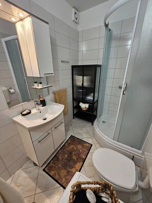 Shower, hair dryer, towels, soap
