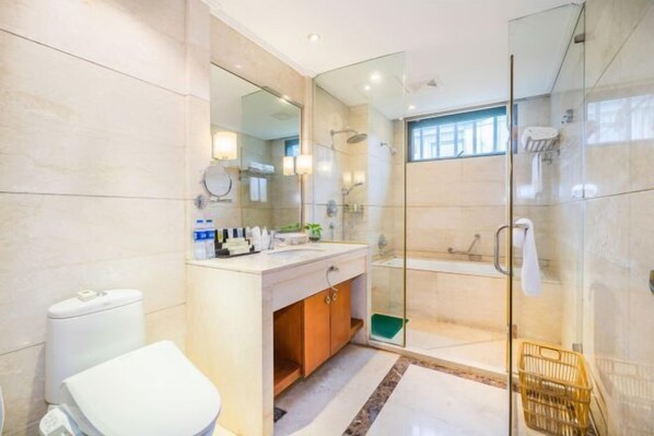 A modern bathroom with a glass-enclosed shower, a toilet, and a vanity with a mirror. - ShangHai NvYan Hotel (Shanghai)