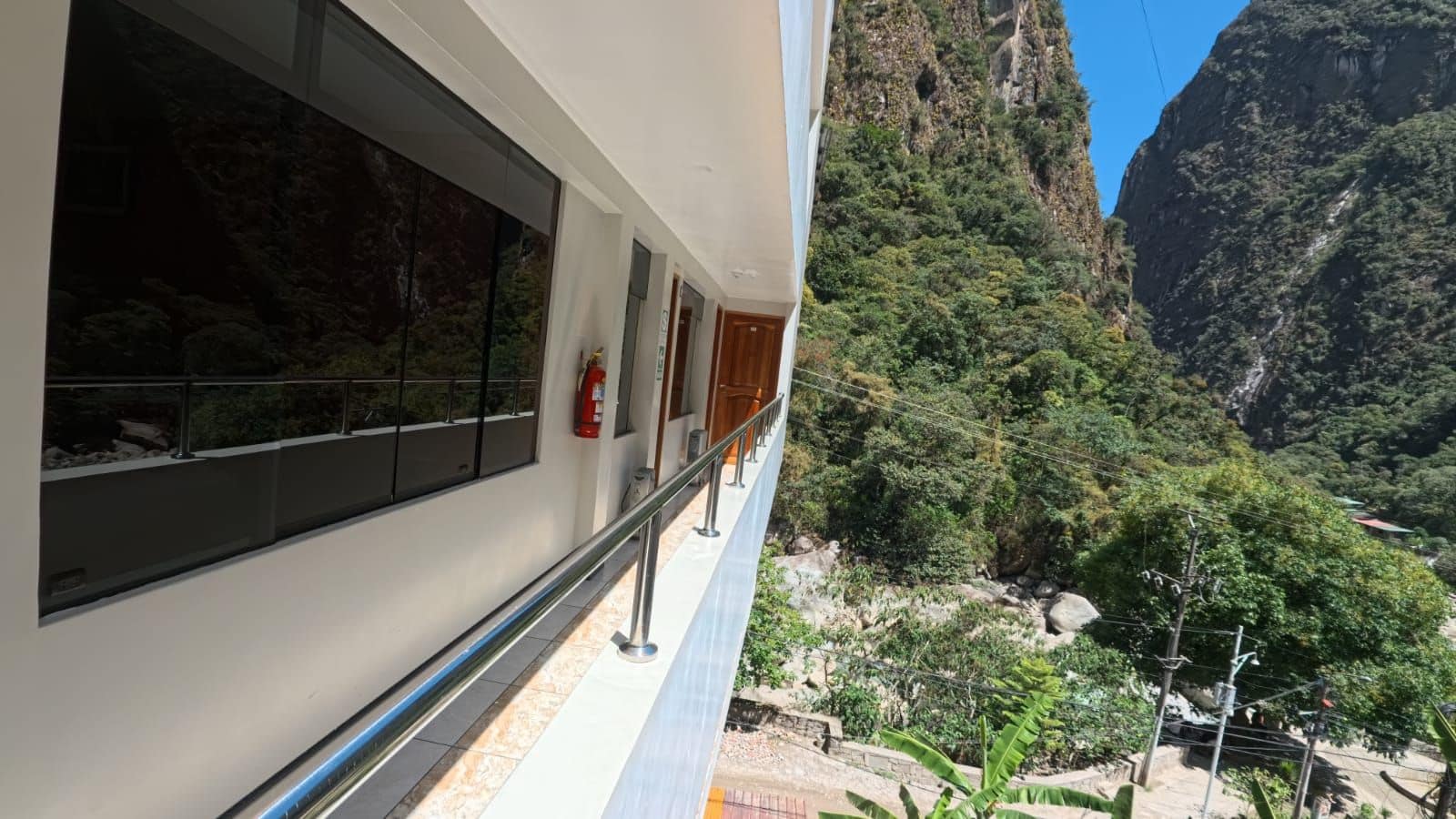 A building with large windows overlooking a mountainous landscape.