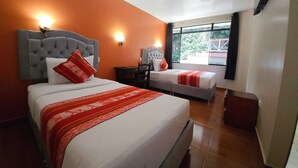 A hotel room with two beds, a large window, and a view of the outdoors. - Hotel Horizonte (Machu Picchu)