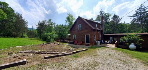 Quiet, country 2 bedroom, 1 bath cabin with 2 optional attached guest apartments