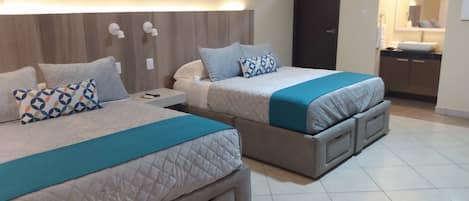 Deluxe Quadruple Room | Egyptian cotton sheets, premium bedding, down comforters, minibar