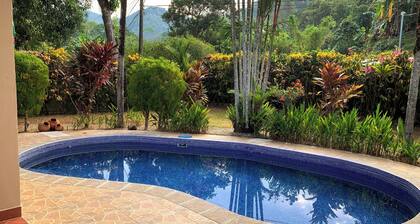10 minutes to the beach! Private home with lush jungle surroundings & pool.