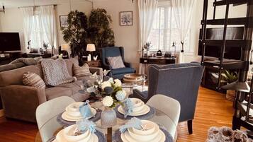 Smart TV, fireplace, books, printers