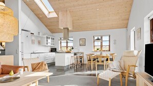 A spacious living area with a kitchen, dining space, and a TV. - Gorgeous home in Ejstrupholm with WiFi (Ejstrupholm)