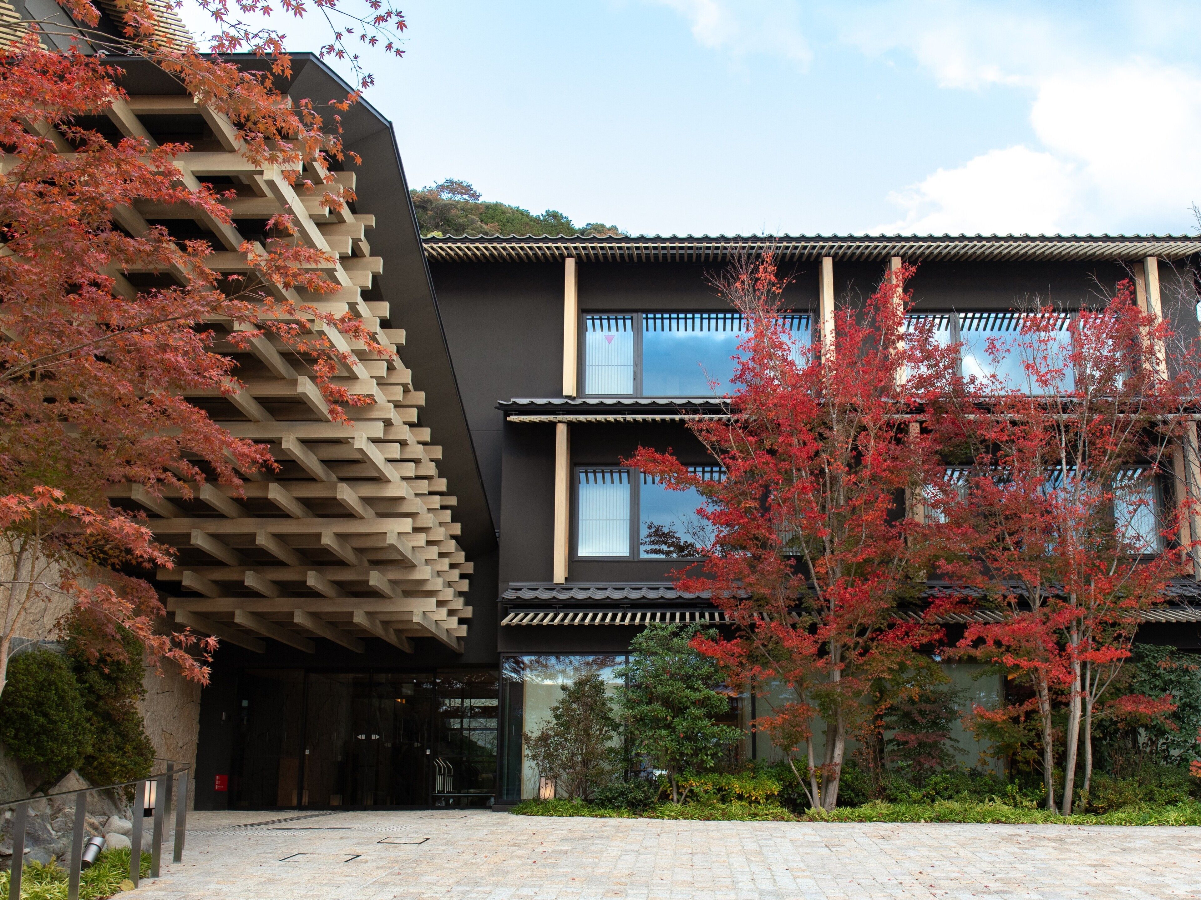 A modern building with a unique architectural design, featuring a combination of traditional and contemporary elements.