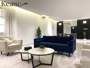 Design Apartment, 3 Bedrooms | Living area | Flat-screen TV
