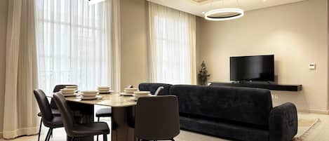 Design Apartment, 3 Bedrooms | Living area | Flat-screen TV