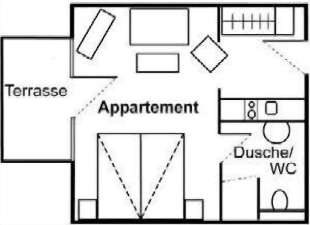 Plànol que mostra una terrassa, un apartament i una zona de lavabos.