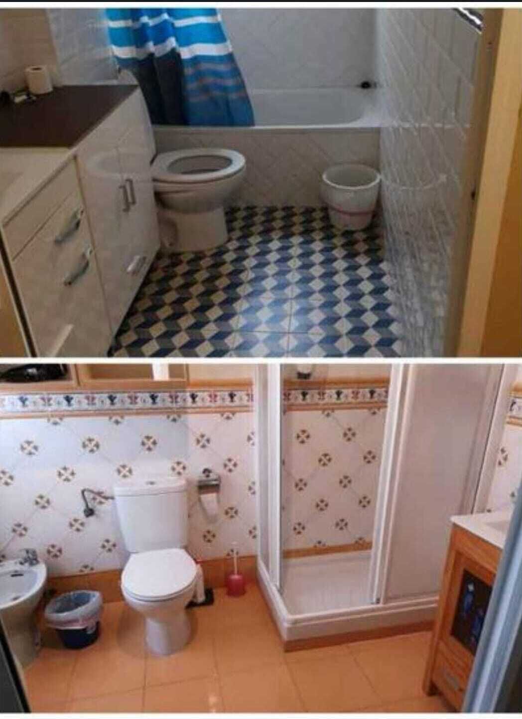 A bathroom with a toilet, a sink, and a shower area.