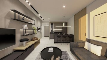 A modern living room with a flat-screen TV, a black coffee table, and a sofa. There is a kitchen area with a bar and stools.