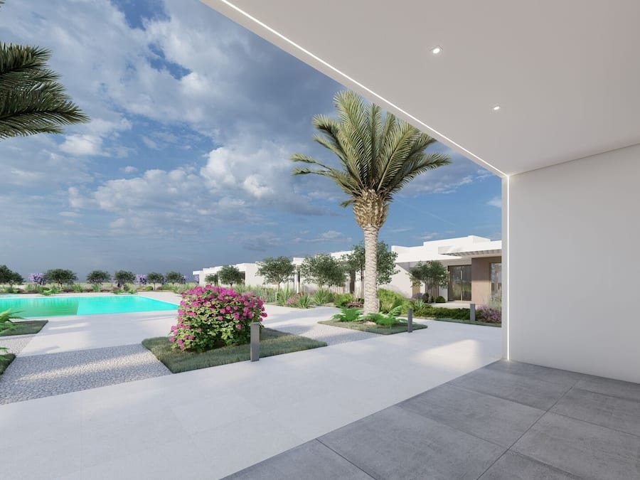 A modern outdoor pool area with a clear sky, palm trees, and a well-maintained garden.