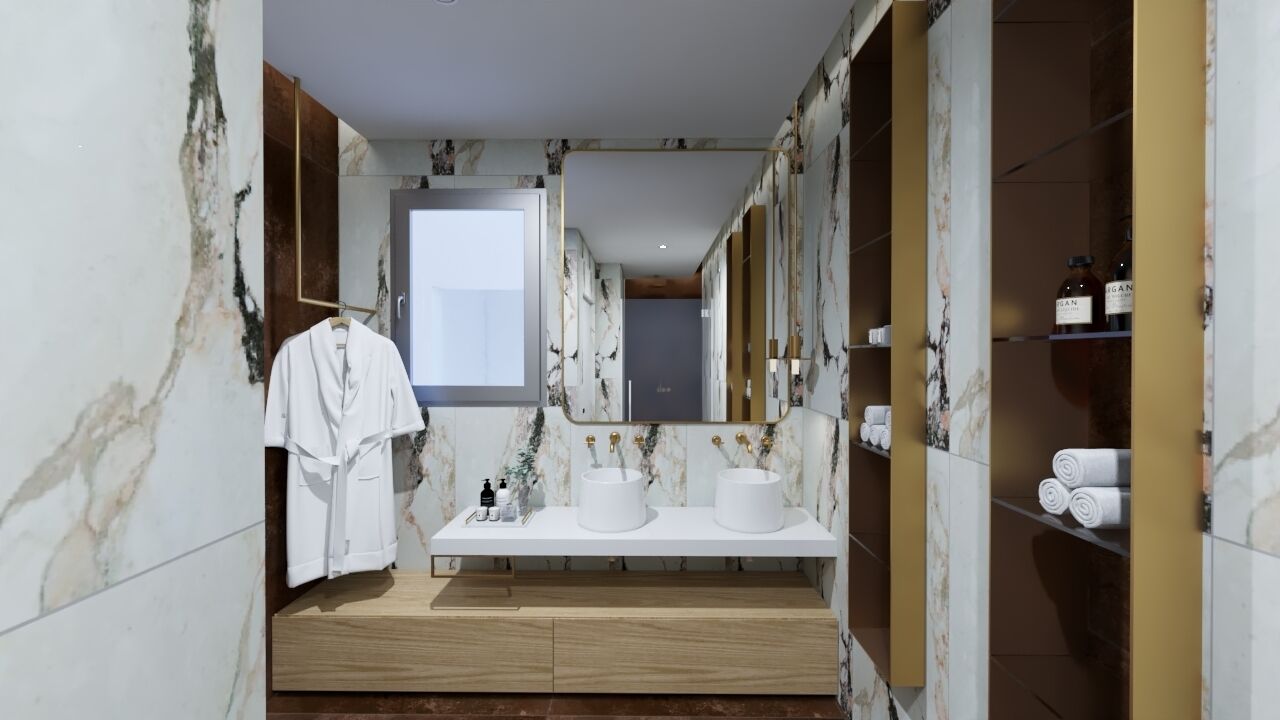 Un baño moderno con paredes de mármol, dos lavamanos, un perchero para albornoces y un espejo.