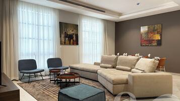 Design Apartment, 3 Bedrooms | Living area | Flat-screen TV