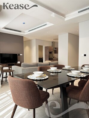 Design Apartment, 3 Bedrooms | Living area | Flat-screen TV