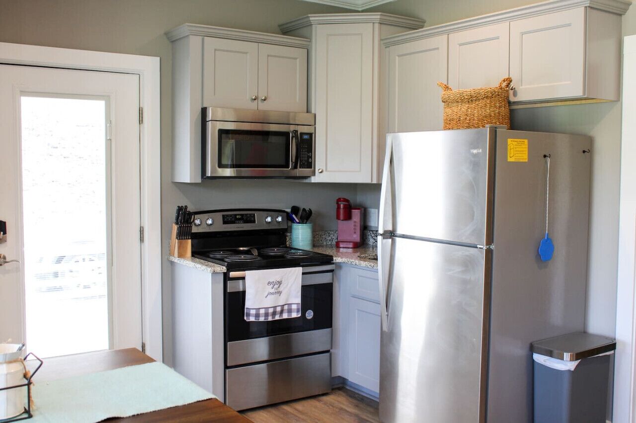 Fridge, oven, coffee/tea maker, cookware/dishes/utensils