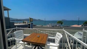 Standard Room, Multiple Beds, Partial Sea View | Terrace/patio