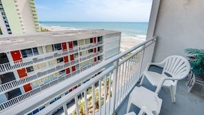 A multi-story building with a balcony overlooking a beach. - Nice Renovated Sea Mist with Amazing Ocean Views (Myrtle Beach)