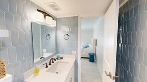 Shower, hair dryer, towels