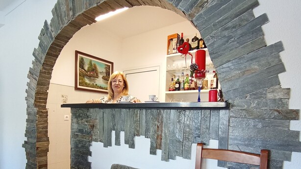 A stone archway leading to a bar area with a sign reading "Casa Talica." - Casa Talika (Ourem)