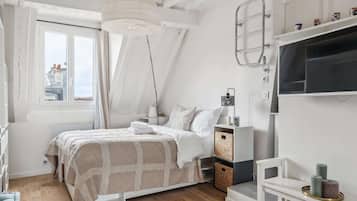 1 bedroom, desk, iron/ironing board, travel crib