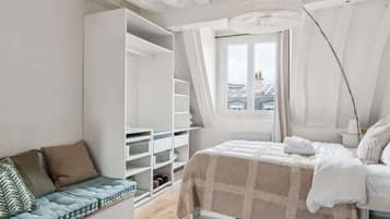 1 bedroom, desk, iron/ironing board, travel crib