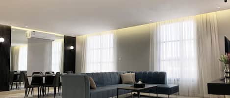 Design Apartment, 3 Bedrooms | Living area | Flat-screen TV