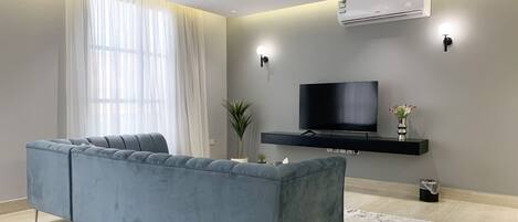 Design Apartment, 3 Bedrooms | Living area | Flat-screen TV