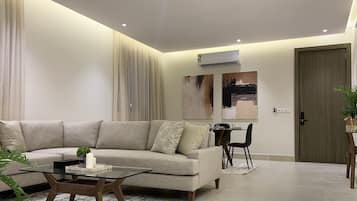 Design Apartment, 3 Bedrooms | Living area | Flat-screen TV