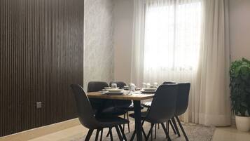 Design Apartment, 3 Bedrooms | Living area | Flat-screen TV