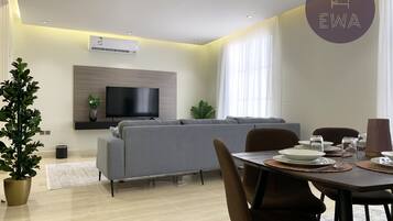 Design Apartment, 3 Bedrooms | Living area | Flat-screen TV