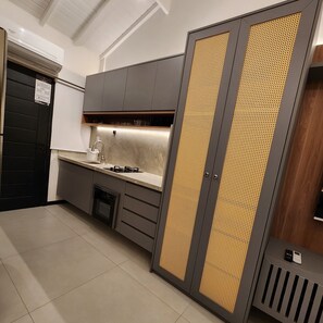 Enjoy cooking in this well-equipped kitchen with an oven, stovetop, and stainless steel sink.