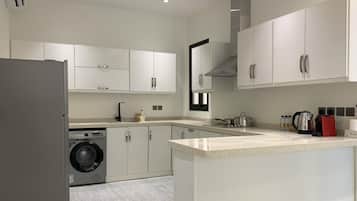 Design Apartment, 3 Bedrooms | Private kitchen | Electric kettle, eco-friendly cleaning products, paper towels
