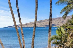 On the beach, sun-loungers, beach towels - Remodeled, Prime Oceanfront, Private corner condo (Kihei)