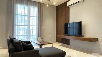Design Apartment, 3 Bedrooms | Living area | Flat-screen TV