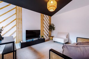 32-inch LED TV with digital channels, Netflix, streaming services - Modern & Chic Four Bedroom Home (Manchester)