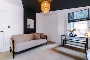 32-inch LED TV with digital channels, Netflix, streaming services - Modern & Chic Four Bedroom Home (Manchester)