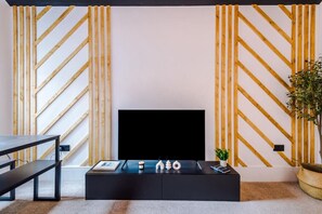 32-inch LED TV with digital channels, Netflix, streaming services - Modern & Chic Four Bedroom Home (Manchester)