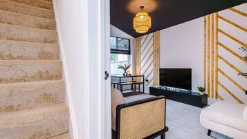 Design House | Living area | 32-inch LED TV with digital channels, Netflix, streaming services