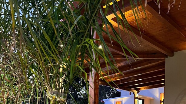 A covered outdoor patio with a dining area, a hammock, and a pool. - Wonderful cottage with swimming pool 100 mt from the sea 🌊 (Trabia)
