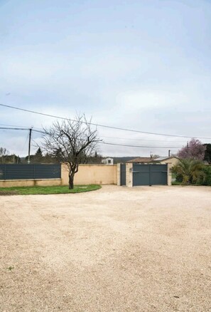 entrance with a tree-lined approach.