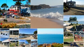 A coastal area with a beach, a promenade, and various buildings including a café and a gas station.