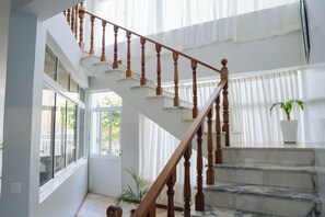 A staircase with wooden balusters leading to a landing.