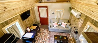 Cozy cabin features features queen pullout and twin in loft. Pet friendly